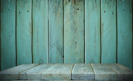 Vintage wood table in woods wall room.の写真素材