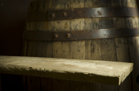 Beer barrel with beer glasses on table on wooden backgroundの写真素材
