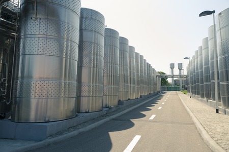 Stainless steel fermenters used to make wine, toned image.の写真素材