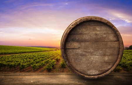 Red wine with barrel on vineyard in green Tuscany, Italy,の写真素材