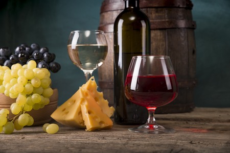 Red wine with barrel on vineyard in green Tuscany, Italy.の写真素材
