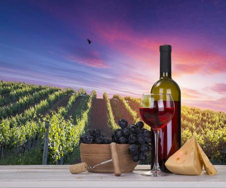 Red wine with barrel on vineyard in green Tuscany, Italy.の写真素材