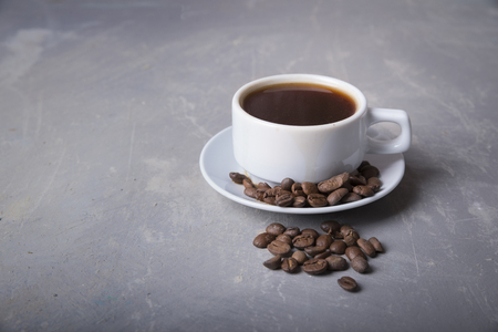 Cup of coffee with brown sugar on a wooden table.の写真素材