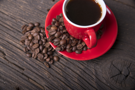 Cup of coffee with brown sugar on a wooden tableの写真素材