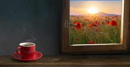 Coffee cup and saucer on a wooden table. Dark background.の写真素材