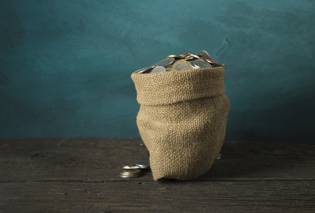 big money bag isolated on a concrete backgroundの写真素材