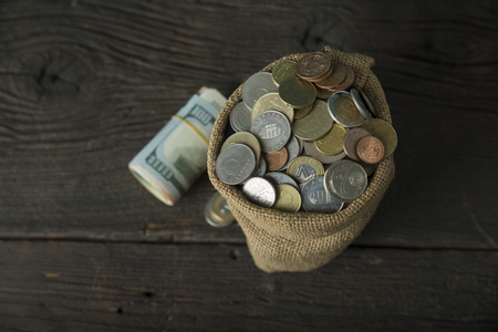 big money bag isolated on a concrete backgroundの写真素材
