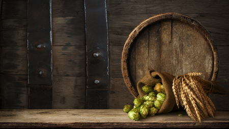 background of barrel and worn old table of woodの写真素材