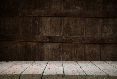background of barrel and worn old table of woodの写真素材
