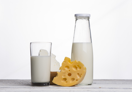 Protein products: cheese, cream, milk, eggs. On a white background.の写真素材