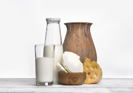 Protein products: cheese, cream, milk, eggs. On a white background.の写真素材