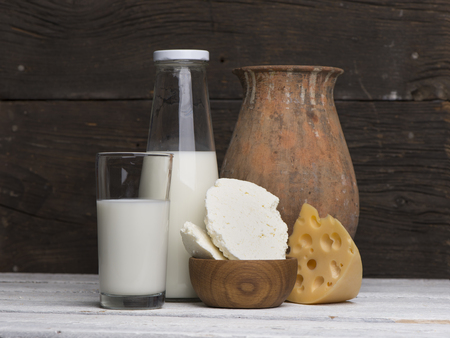 Protein products: cheese, cream, milk, eggs. On a white background.の写真素材