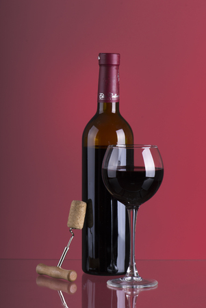 Red wine. Glass of wine. Pouring red wine.の写真素材