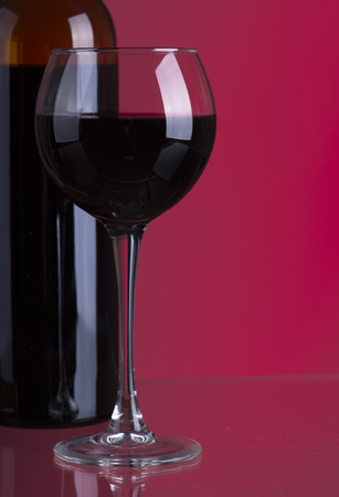 Red wine. Glass of wine. Pouring red wine.の写真素材