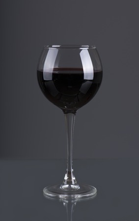 Red wine. Glass of wine. Pouring red wine.の写真素材