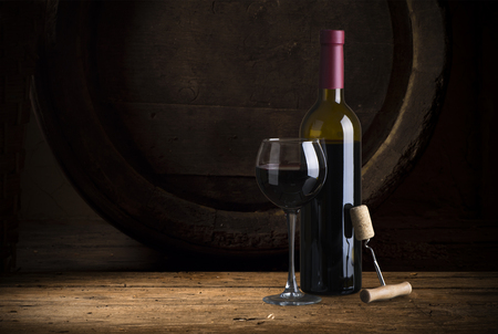 Closeup of red wine pouring in glassの写真素材