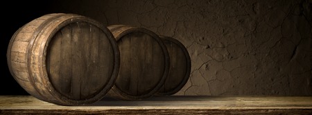 corkscrew and wooden barrel, vineyard on backgroundの写真素材