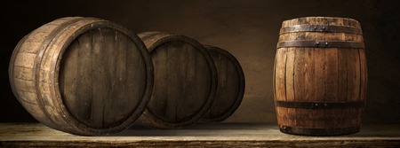 corkscrew and wooden barrel, vineyard on backgroundの写真素材