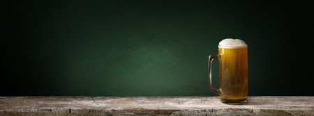 background of barrel and worn old table of woodの写真素材