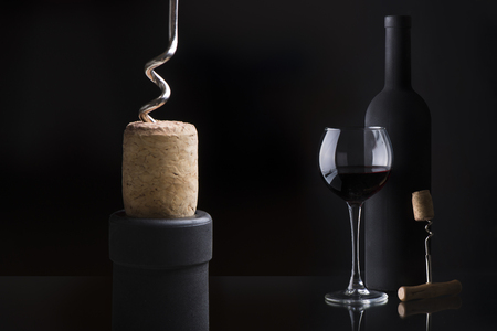 Macro shot of bottle of wine with corkscrewの写真素材