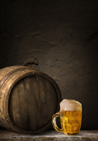 background of barrel and worn old table of woodの写真素材
