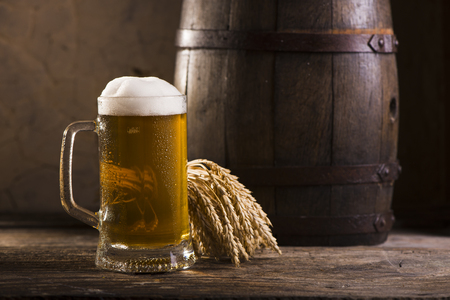 Glasses of light and dark beer on a pub background.の写真素材
