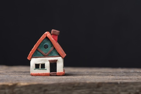 mortgage, investment, real estate and property concept - close up of home model, money and house keysの写真素材