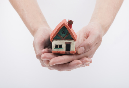mortgage, investment, real estate and property concept - close up of home model, money and house keysの写真素材