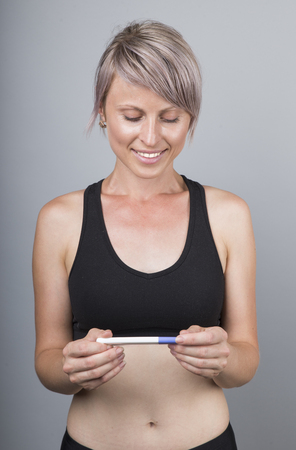 Woman holding pregnancy test, New life and new family concept.の写真素材