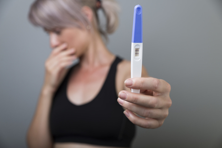 Woman holding pregnancy test, New life and new family concept.の写真素材