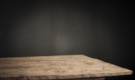 background of barrel and worn old table of woodの写真素材