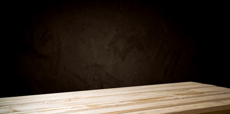 background of barrel and worn old table of woodの写真素材