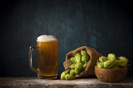 Glass beer on wood background with copy space