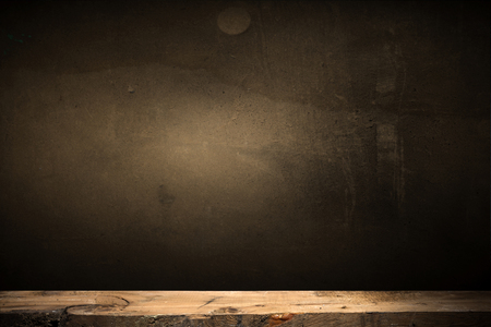 Wooden deck table on green grunge backgroundの写真素材