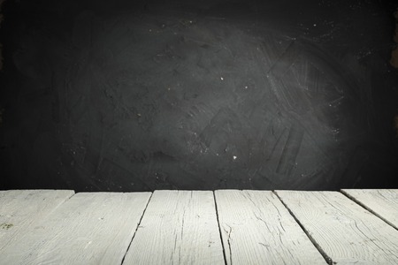 Old wood table top with smoke in the dark backgroundの写真素材