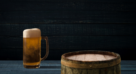 background barrel and worn old table of woodの写真素材