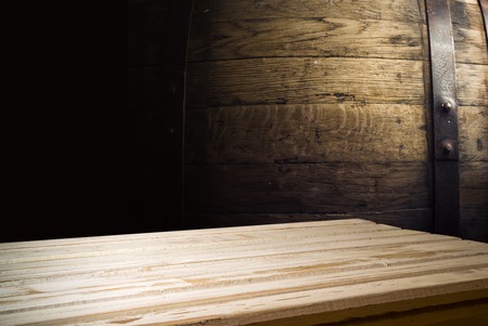 background of barrel and worn old table of wood.