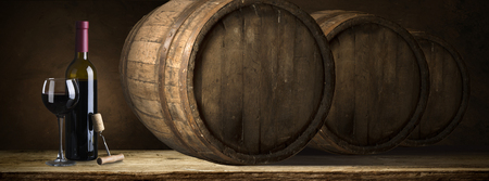background of barrel and worn old table of woodの写真素材