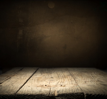 background of barrel and worn old table of woodの写真素材