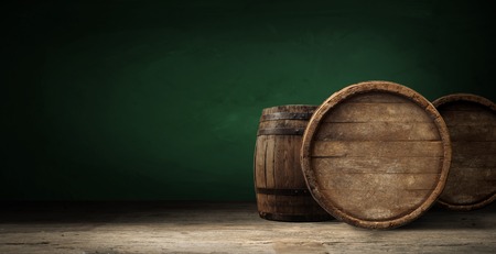 background of barrel and worn old table of wood.の写真素材