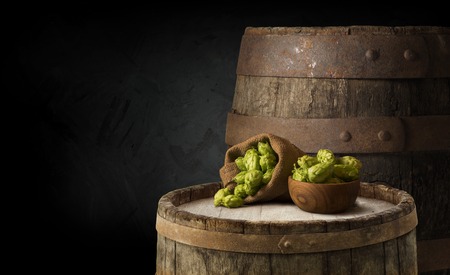 Beer barrel with beer glass on table on wooden backgroundの写真素材