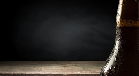 Old wood table top with smoke in the dark background.の写真素材