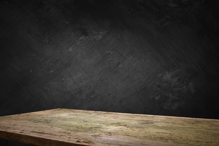 Wooden deck table on grey grunge background.の写真素材