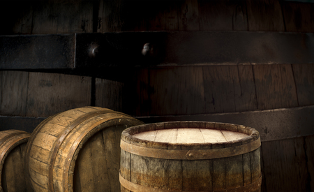 background of barrel and worn old table of wood.の写真素材