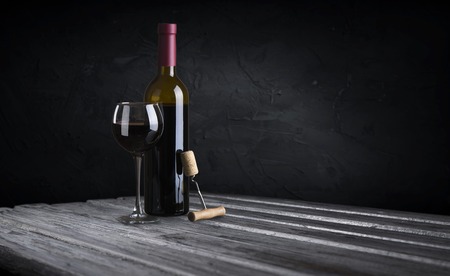 Row of vintage wine bottles in a wine cellarの写真素材