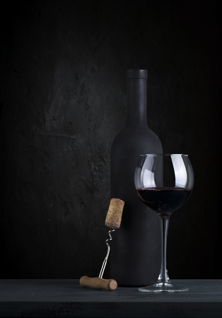 corkscrew and wooden barrel, vineyard on backgroundの写真素材