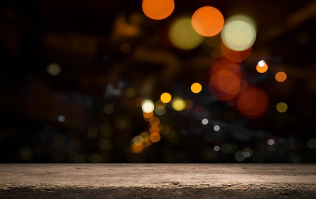 Festive wooden background with glittering bokeh lights, illuminated by a spotlight, ideal for...