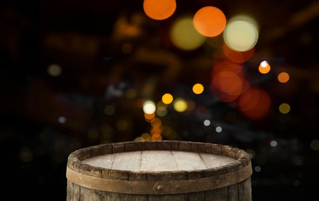 Festive wooden background with glittering bokeh lights, illuminated by a spotlight, ideal for Christmas or other occasionsの写真素材
