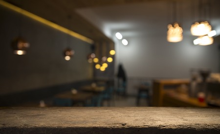 blurred background of bar and dark brown desk space of retro woodの写真素材