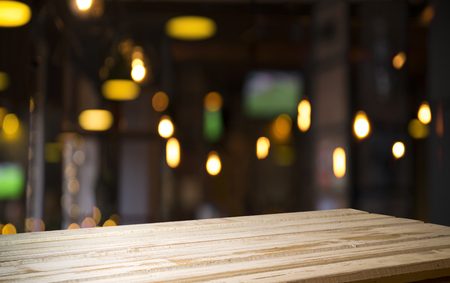 blurred background of bar and dark brown desk space of retro woodの写真素材